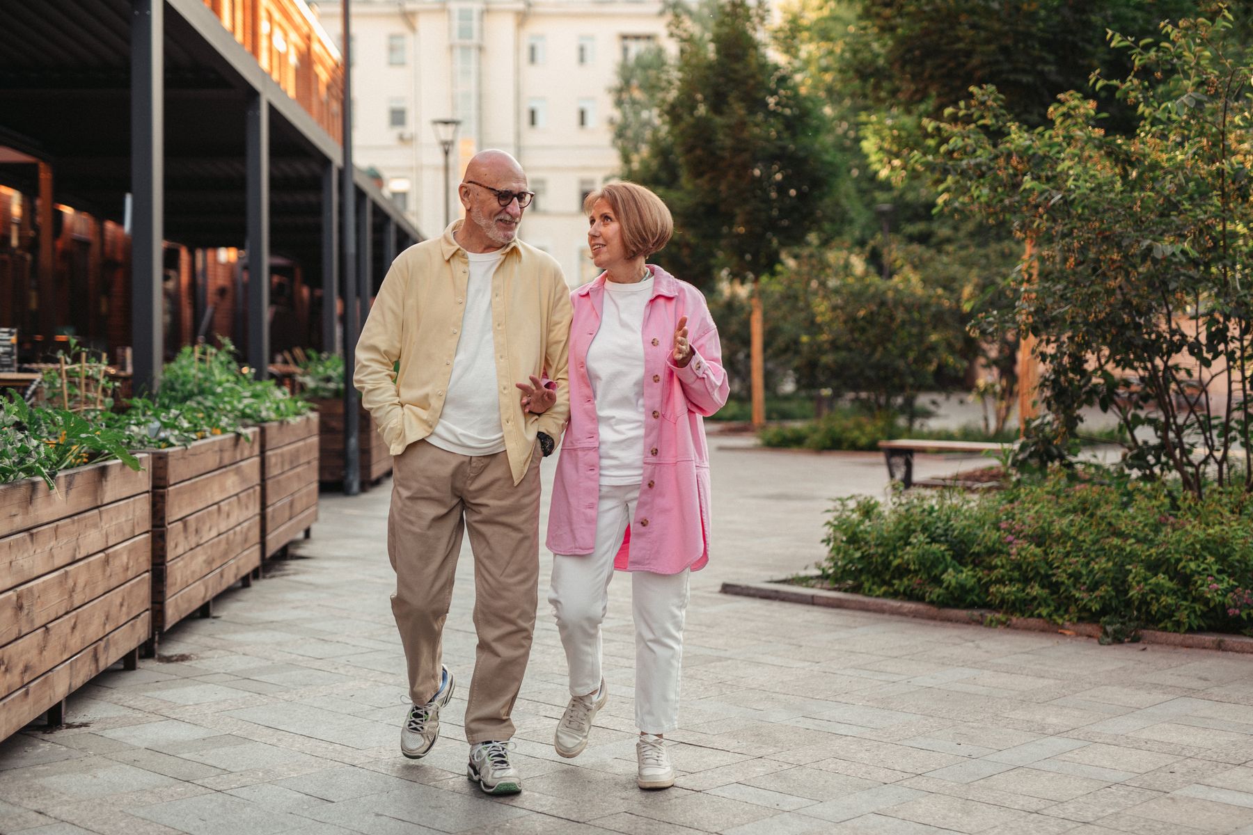 An older couple enjoying a walk together outside